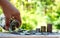 Businessmen are pouring money bottles onto wooden floors