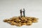 Businessmen shake hands as a symbol of a successful profitable transaction. Businessmen on a stack of gold coins as a symbol of