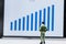 Businessmen stand and look at the graph Marketing Growth display