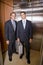 Businessmen standing in elevator