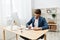 businessmen writes in documents at the desk in the office Gray background