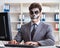 Businessmsn with scary face mask working in office