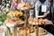 Businesspeople at banquet lunch break at business conference meeting. Assortment of canapes and finger food on the table