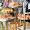 Businesspeople at banquet lunch break at business conference meeting. Assortment of canapes and finger food on the table