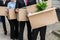 Businesspeople With Cardboard Boxes