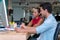 Businesspeople colleagues talking about planning project in the workplace. Woman holding pencil in her hand with man sitting