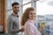 Businesspeople Couple Hold Cups Coffee Break In Coworking Center Coworkers Standing in front Panoramic Window