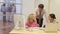 Businesspeople at desk with coworkers in background