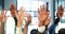 Businesspeople, hands and raise for teamwork in office for volunteer, vote or question. Diverse group, employees or