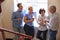 Businesspeople Having Informal Meeting On Office Stairs