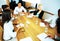 Businesspeople having meeting around table