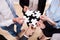 Businesspeople holding jigsaw puzzle