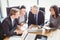 Businesspeople interacting in conference room