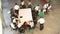 Businesspeople Leaving At The End Of Meeting Around Table