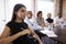 Businesspeople Listening To Presentation In Boardroom