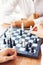 Businesspeople playing chess in office