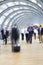 Businesspeople rushing in corridor, motion blur