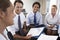 Businesspeople Seated In Circle At Company Seminar