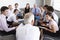 Businesspeople Seated In Circle At Company Seminar