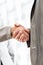 Businesspeople shaking hands over a blurred abstract background