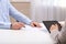 Businesspeople signing contract at white table in office, closeup of hands