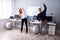 Businesspeople Standing In Office Doing Exercise