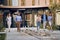 Businesspeople walking and talking in front of business building