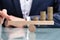 Businessperson Balancing Increasing Stacked Coins With Finger