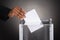 Businessperson Hand Inserting Ballot In Box