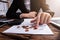 Businessperson`s Hand Counting Coins