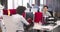 Businesswoman Arriving In Office And Sitting At Desk