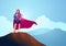 Businesswoman as a superhero standing on the top of a mountain
