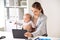 Businesswoman with baby and tablet pc at office