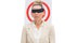 Businesswoman blindfolded in front of target