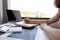 Businesswoman bookkeeper hand note analysis the graph with calculator and laptop at the home office for setting challenging