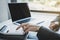 Businesswoman bookkeeper hand use calculator and analysis the graph with laptop at the home office for setting challenging