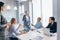 Businesswoman briefing her colleagues in office. Businesspeople working.