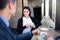 Businesswoman and businessman drinking coffee in cafe