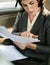 Businesswoman Busy Working Car Inside