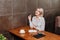 Businesswoman in cafe with coffee and notebook