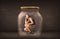 Businesswoman captured in a glass jar concept