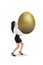 Businesswoman carry golden egg - isolated
