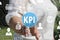 The businesswoman clicks the button KPI, Key Performance Indica