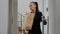 Businesswoman climbing stairs carrying takeaway food order bag during takeout lunchtime