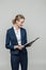 Businesswoman with clipboard and documents