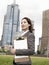 Businesswoman With Clipboard Outside Office Building