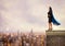 Businesswoman with a cloak acts like a super hero