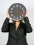 Businesswoman and clock