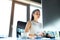 Businesswoman with computer in her office, working.