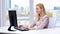 Businesswoman with computer typing at office